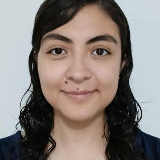 Portait of Alicia smiling softly with a black shirt on